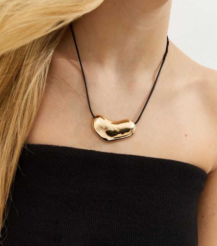 Gold Tone Sleek Oval Dome Rope Necklace