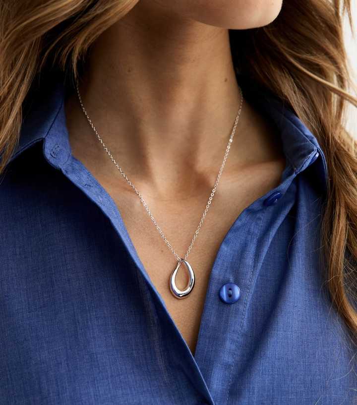 Silver Tone Abstract Oval Pendant Necklace