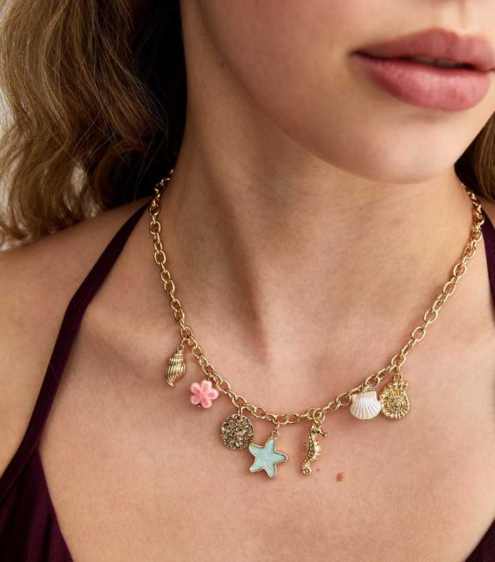 Gold Tone Shell and Starfish Charm Necklace