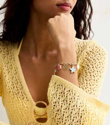 Gold Tone Shell and Starfish Charm Bracelet