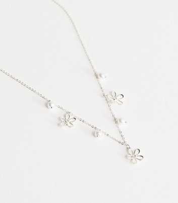 Silver Tone Cutout Flower Charm Necklace