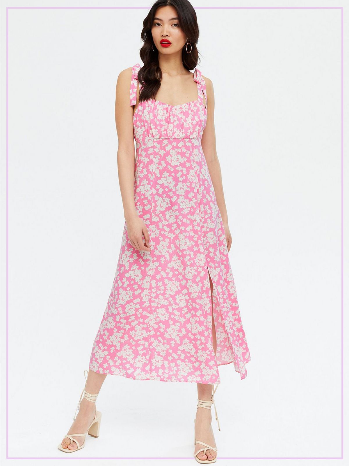 Woman Wearing a Pink Floral Ruched Tie Strap Midi Dress and Heels