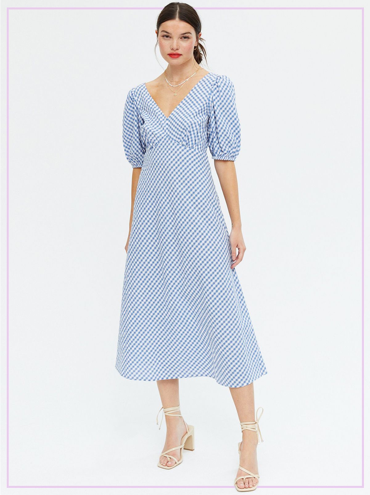 Woman Wearing a Blue Gingham V Neck Midi Dress and White Strappy Heels