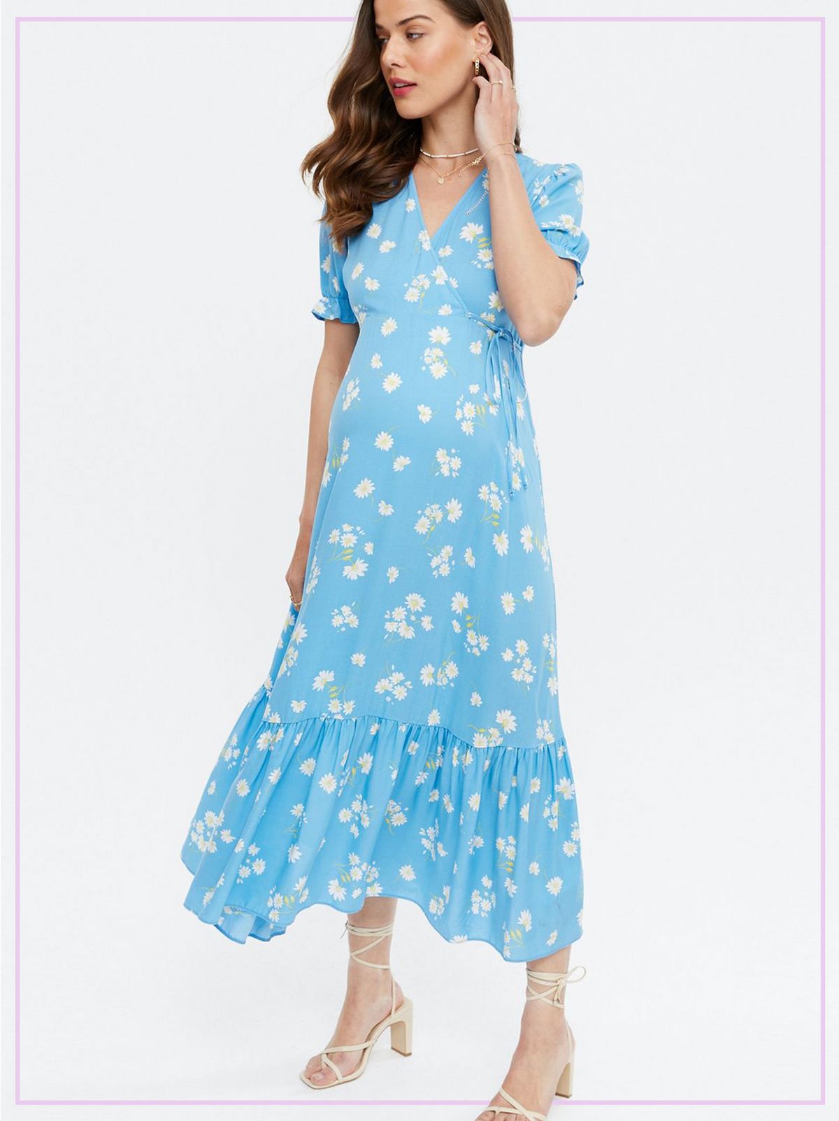 Woman Wearing a Blue Floral Puff Sleeve Midi Wrap Dress and White Strappy Heels