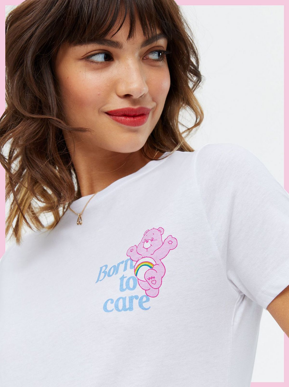 Woman wearing a White Care Bears Born To Care Logo T-Shirt